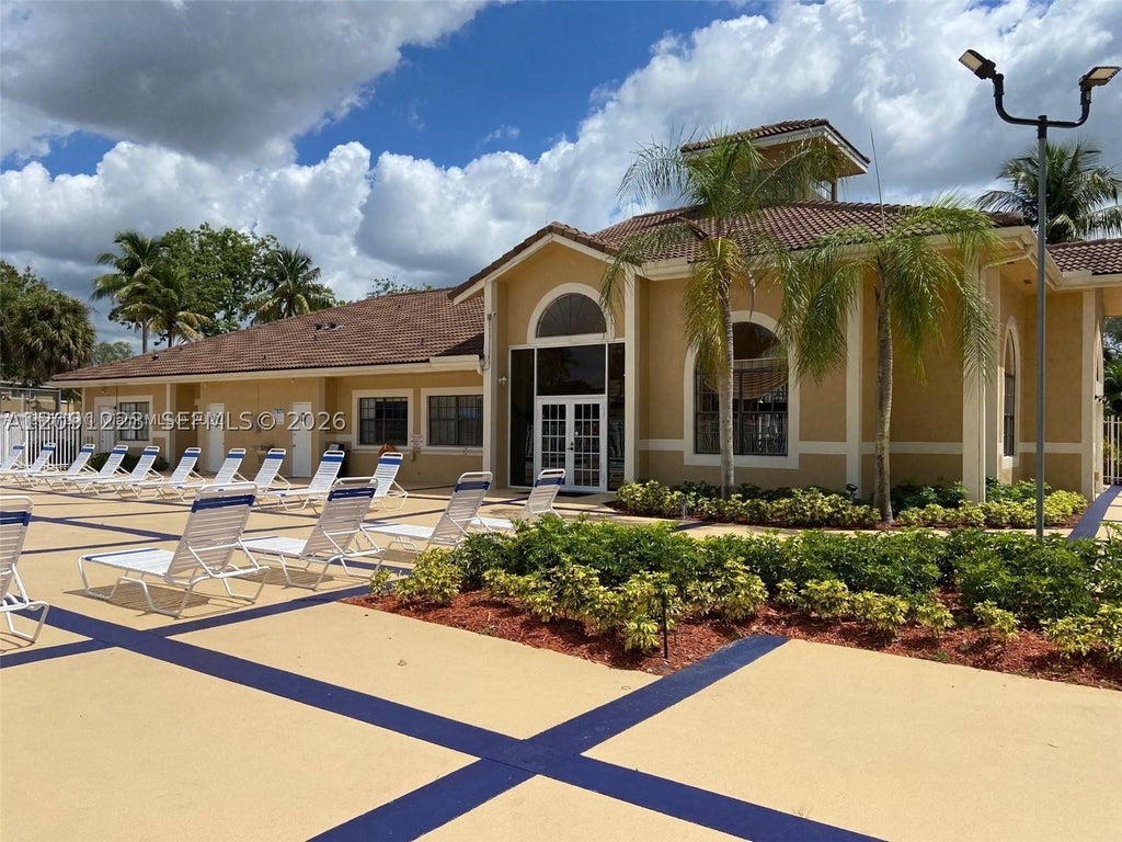 Photo of 450 W Palm Circle #202, Pembroke Pines, FL 33025 (MLS # A12091223)