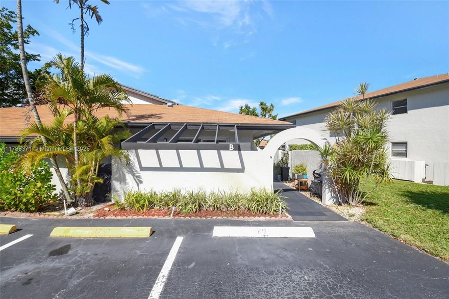 Gorgeous, fully renovated, and spacious villa in The Palm Greens community, offering serene lake views. This home boasts vaulted ceilings, modern touches, and a charming Florida room facing the lake! The kitchen and bathrooms feature custom cabinetry, elegant stone countertops. The split floor plan offers a generous primary suite with wood laminate flooring, an oversized walk-in closet, and a separate linen closet. Additional upgrades include hurricane windows and more!