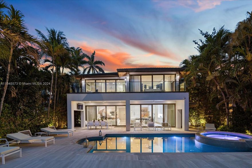 Lush tropical landscaping envelops this exquisite contemporary waterfront residence with mesmerizing vistas of Miami Beach from its expansive floor-to-ceiling telescopic sliding glass doors. Featuring 7 bedrooms, 7.5 bathrooms, an elegant Italian kitchen, Miele/SubZero appliances, luxurious Dornbracht bath fixtures, and a cutting-edge Lutron lighting/Savant automated Smart system. Immerse yourself in tranquility and seclusion as you step into the home's picturesque courtyard entrance and then walk thru the open plan home to the spacious outdoor with wide bay water views. Experience the ultimate Miami lifestyle as you are walking distance to Sunset Harbor, and minutes from Design District and downtown with prestigious shopping, fine dining and nightlife.