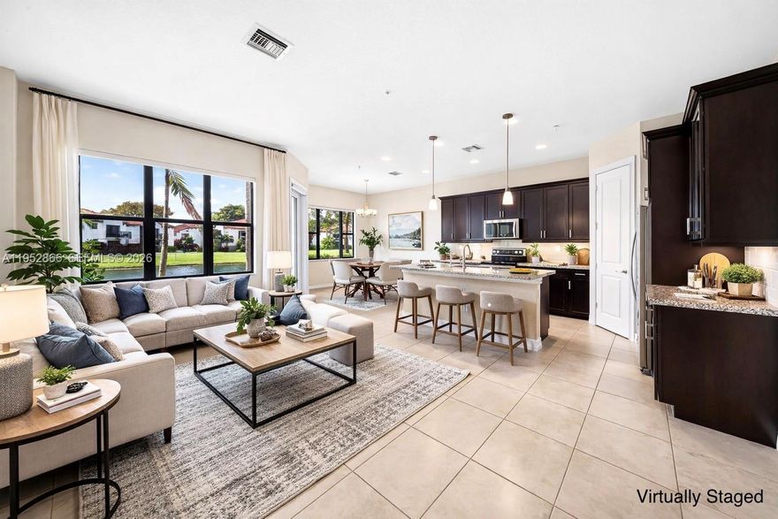 Built in 2018 and located within the gated Raintree community, this like-new townhome (Vallejo model) sits on a prime waterfront lot and offers 3 Bedrooms, 2.5 Bathrooms, a Den, and a 2-car Garage. | The open-concept layout features a beautifully Upgraded Kitchen with Pantry and 3-Stage Reverse Osmosis Water Filter, Automatic Blinds in the main living areas and primary bedroom, and fully Impact Windows and Doors throughout. | Primary Bedroom features 2 Walk-In Closets and a Private Balcony. | Raintree features resort-style amenities including a pool, fitness center, and on-site management. | Centrally located just minutes from dining, shopping, and major highways. | This home presents a rare blend of comfort, convenience, and like-new condition.