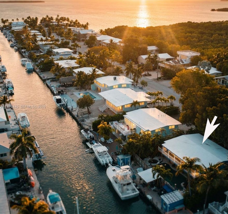 Motivated Seller!! Great investment opportunity in the Upper Keys. 2364 SqFt  3/2 CBS, Reinforced Concrete Roof. Ocean Side home. Enjoy your own private waterfront getaway with a zero-entry pool and spa, and custom tiki bars—perfect for relaxing or entertaining day or night. Boaters will love the 70' concrete dock & deep water canal with direct ocean access and quick bay access through Tavernier Creek. Set on a fully fenced 8,050 sq ft lot landscaped for lots of privacy. Close to top rated schools, shopping, dining, and entertainment, so you get peaceful island living with the best of the keys nearby.