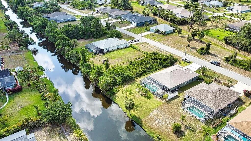 Discover the perfect canvas for your dream home at 150 Albatross Road, Rotonda West.
This beautiful waterfront parcel offers a rare opportunity to build in one of Southwest Florida’s most peaceful and picturesque communities. Imagine waking up to serene water views, enjoying quiet mornings surrounded by nature, and watching the sunset from your future lanai.
Nestled on a quiet street, this lot combines privacy with the charm of a well-established neighborhood. Whether you're planning a seasonal getaway or a forever home, this location provides the ideal setting for Florida living at its finest.
Utilities nearby, no HOA fees, and close proximity to golf courses, Gulf beaches, and local amenities make this an unbeatable opportunity. Don’t just dream it—build it.