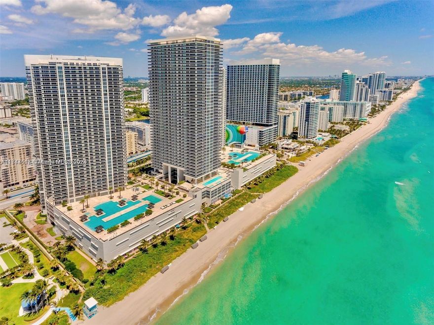 Stunning high-floor 2BD + Den/3BA condo in Hallandale Beach with breathtaking intracoastal and city views. This spacious 1,571 sq. ft. unit features a 177 sq. ft. balcony, perfect for soaking in the scenery. Located directly on the ocean, the building offers world-class amenities: a 50,000 sq. ft. full-service spa and fitness center, two-story gym, multiple pools, Jacuzzis, sauna, steam room, spa services, poolside café, restaurant, and bar with pool service. Enjoy 24-hour valet parking and security, all within a prestigious 9-acre property boasting 900 ft. of ocean frontage. Live the ultimate beachfront lifestyle with luxury, convenience, and relaxation at your fingertips!