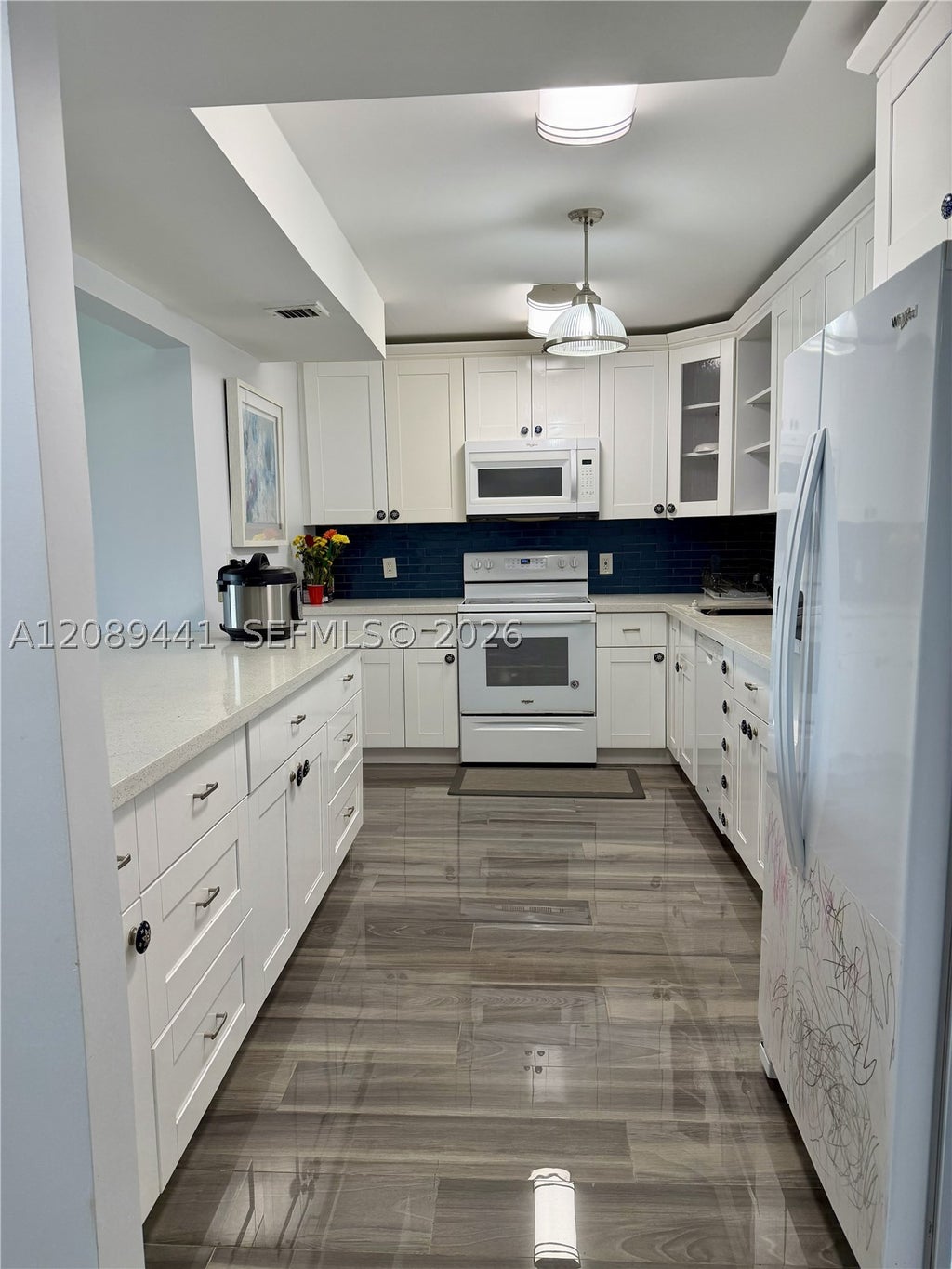 Photo of 2681 S Course Dr #406, Pompano Beach, FL 33069 (MLS # A12089441)