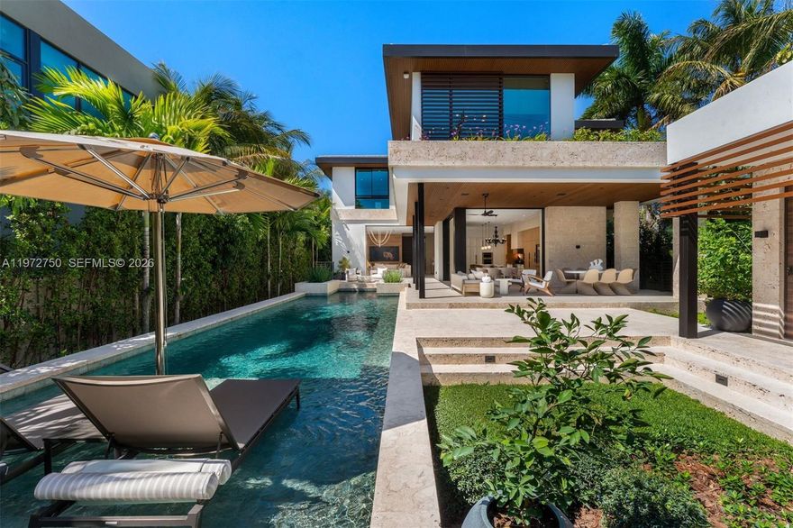 Set along the Miami Beach Golf Club, this newly built residence by Strang Design Architecture is a serene retreat for modern luxury living. Behind a gated entry, light-filled interiors span 4,300 SF with 4 en-suite bedrooms, a private office and gym. The chef’s kitchen features Mia Cucina cabinetry, Wolf & Sub-Zero appliances, quartzite island and dual dishwashers, the kitchen and living areas seamlessly open to the outdoors for effortless indoor/outdoor living. Outside, a saltwater pool with heating and cooling and a summer kitchen invite year-round entertaining. The primary suite offers a balcony, spa bath, sauna and dual walk-in closets. Smart-home technology, generator, advanced security and multi-zone climate control complete this exceptional lifestyle offering.