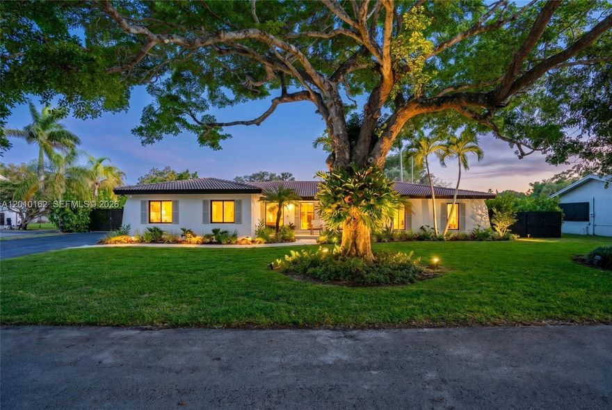 Charming and tastefully renovated home in Palmetto Bay! This beautifully updated 4-bedroom, 2-bath home is magazine worthy! Featuring a bright open-concept layout, the home welcomes you with a spacious living room overlooking the front garden, flowing effortlessly into the dining area and a stunning, fully renovated kitchen complete with marble countertops and custom finishes. The adjacent family room showcases a thoughtfully designed built-in, creating the perfect space for everyday living and entertaining.
All four bedrooms are thoughtfully positioned on one side of the home, including a serene primary suite with a walk-in closet, double vanities, soaking tub, walk-in shower, and peaceful views of the backyard. Both bathrooms have been impeccably renovated with high-end finishes throughout. Step outside to your private backyard oasis, featuring a pool, summer kitchen, expansive yard space, and plenty of room to entertain. Additional highlights include impact windows and doors (excluding garage), a 2-car garage, oversized laundry room, 2018 roof, and plumbing lined with PVC for added peace of mind. A move-in-ready home that perfectly combines modern upgrades with timeless charm in one of Palmetto Bay’s most desirable neighborhoods.