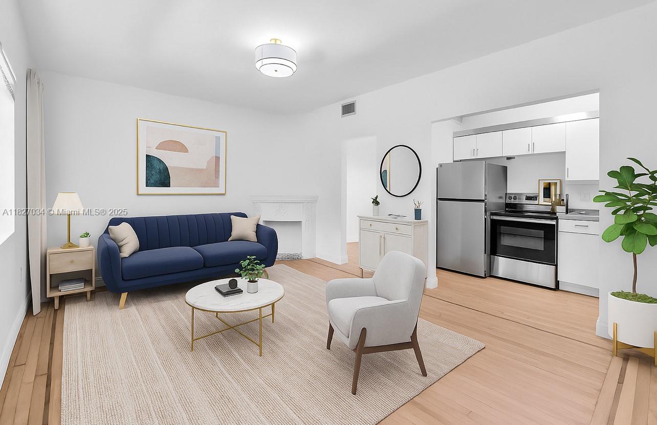 This newly renovated, charming & unique top floor corner unit is available now. Delivered unfurnished, this gorgeous apartment features refinished light hardwood floors, washer/dryer, recessed lighting, decorative fireplace, impact windows, stunning brand new bathroom & den that can be used as dining room, office or guest bedroom. Ideally located in the sweet spot of the tree lined Meridian Ave directy across the street from the tennis courts and the entrance to Flamingo Park. To add to that, from 11th to 15th street exclusively on Meridian Ave, the trees are lit up nightly, a breathtaking sight to enjoy every evening on the street of your new condo. Situated in a quiet boutique Art Deco buiilding. Video available upon request. Shedule your showing today!