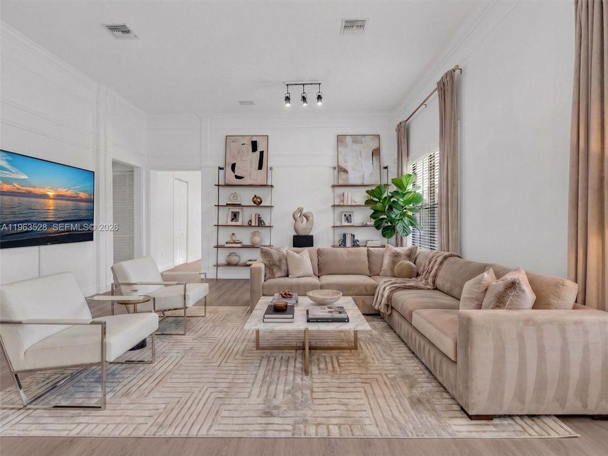 Beautiful 4-bedroom, 3-bathroom single-family home located in Cooper City’s most sought-after gated community of Monterra. This spacious residence features a bright open-concept floor plan enhanced by stunning 36x36 marble and wood flooring throughout. The luxurious primary suite boasts a spa-like bathroom with designer faucets and toilet, a Jacuzzi tub, and a built-in TV for ultimate relaxation. Additional upgrades include crown molding, hurricane-impact glass, a two-car garage, and surround sound throughout. The private backyard oasis showcases professionally designed landscaping, creating the perfect retreat for outdoor living and entertaining.  Monterra offers resort-style amenities, including tennis and basketball courts, a fitness center, and a dog park. Ideally located near A+ rated schools, shopping, dining, and major highways in the heart of Cooper City.