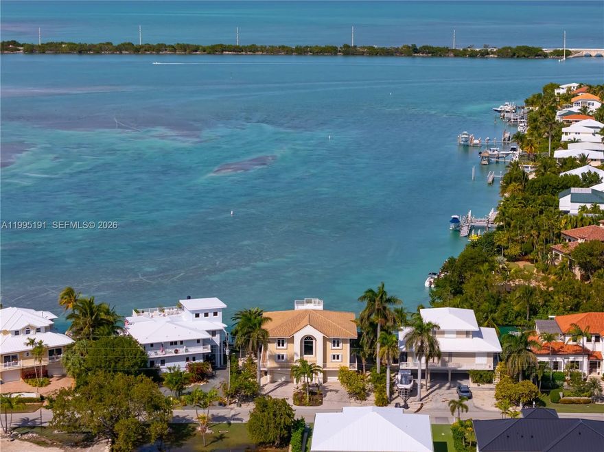 Open water Sunset Views Exclusive Duck Key Waterfront Retreat Experience the pinnacle of coastal living in this exceptional open-water home on Duck Key. Designed to capture stunning ocean vistas and mesmerizing sunsets, this 4-bedroom, 3-bathroom gem offers the perfect balance of luxury, comfort, and outdoor paradise. Expansive Open-concept design featuring a gourmet kitchen with granite countertops, spacious dining, and living areas perfect for entertaining or relaxing by the water. Two large enclosed porches provide year-round enjoyment of ocean breezes and views. Ascend the spiral staircase to a rooftop deck with 360-degree vistas - a perfect spot for sunset cocktails. The home includes a dumbwaiter shaft for effortless transport of groceries or luggage, plus a solid oak staircase leading from the grand foyer. A private tiki hut offers shade and tranquility, while the 15K boat lift caters to boating enthusiasts. There's ample space to add a pool. Two oversized garages provide plenty of room for vehicles, watercraft, and more, with additional storage throughout the home for all your needs. This home has been lovingly cared for inside and out, offering a move-in-ready opportunity to enjoy life on Duck Key. Situated in one of the Florida Keys' most sought-after locations, this property is a dream come true for those seeking serenity, endless water views, and the best of island living. Schedule your private showing today and make this coastal retreat your forever home!