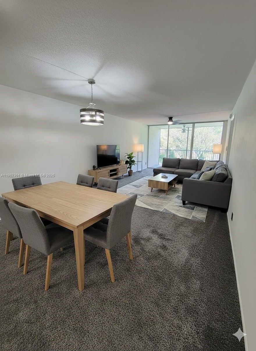 Calm and Spacious 2/2 Corner Unit with pool and garden view. Step into this bright and inviting corner condo featuring large windows that fill every room with natural light. Relax on your screened balcony overlooking the serene pool and lush gardens. Located on the 2nd floor this freshly painted home has been beautifully updated with cozy carpet in the bedrooms and living room and modern bathrooms.  The kitchen features granite countertops and a brand new dish washer. Washer and dryer included in the unit, cat and small dog friendly, water and trash included.