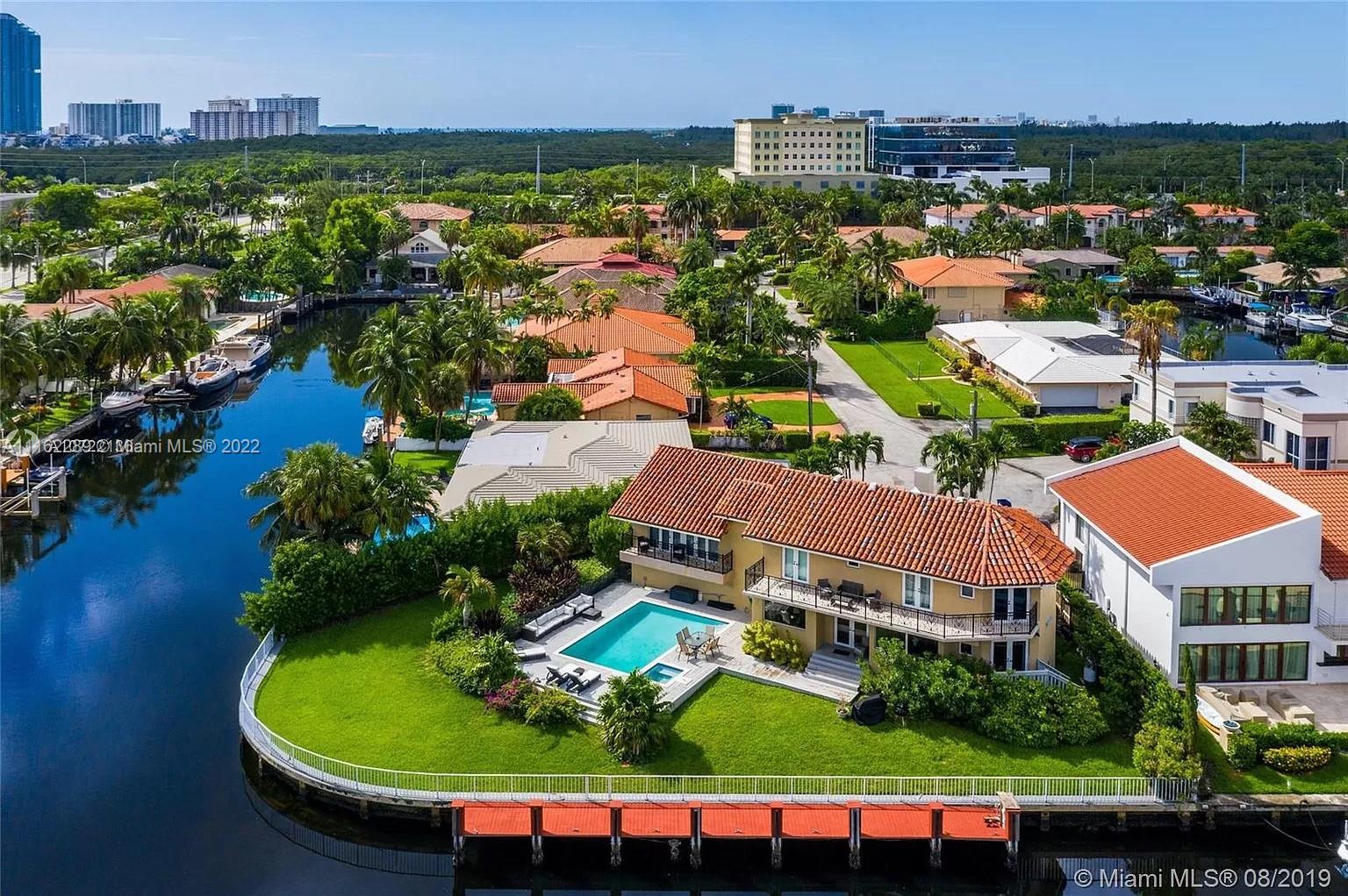Step inside this one of a kind waterfront home with top notch tropical designer furnishings. Located In a private gated community of Eastern Shores. 5 Suites 5.5 Full bathrooms each having its own walking closet. This magnificent house has A formal dining room, open kitchen with gourmet Viking professional appliances, huge double refrigerator, double oven, gas stove and griddle top. A movie theatre room. Marble and wood floors throughout. 
Oversized lot of approx. 180 ft of Waterfront on deep water-wide canal ***NO FIX BRIDGES***for a yacht and extra boat. The generous outdoor area provided you with the ultimate entertaining space has a heated pool and lush landscape. Enjoy the stunning waterfront views.
