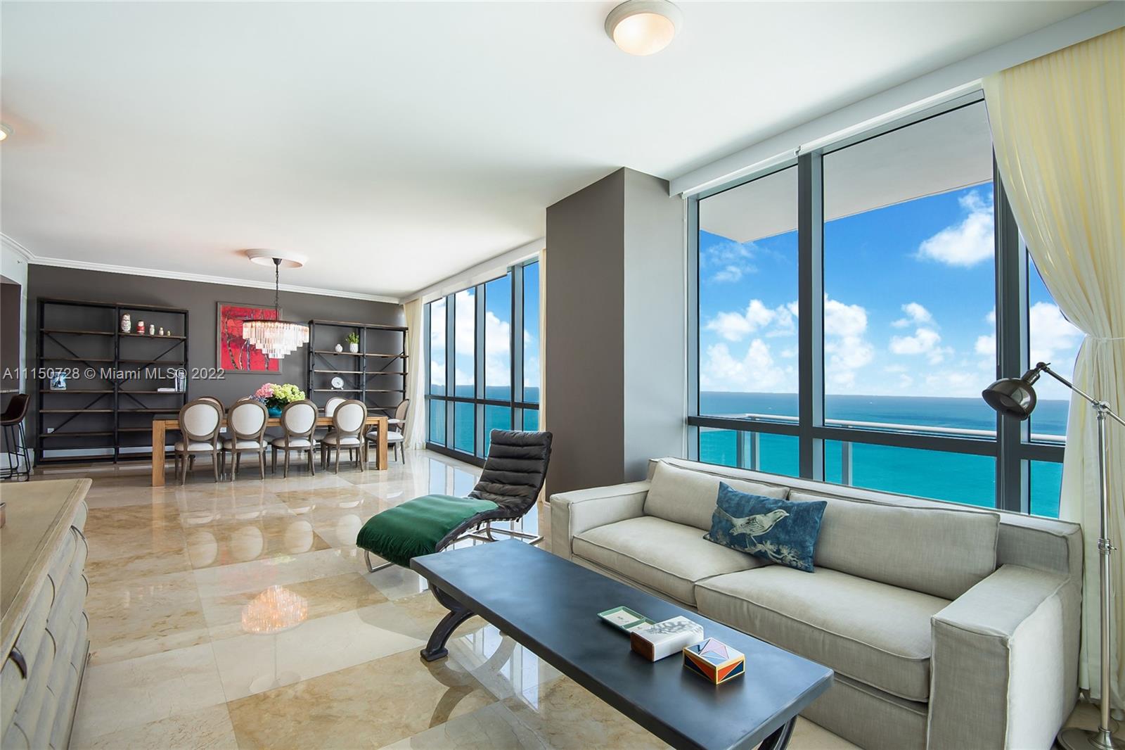EXCEPTIONAL SOUTHEAST CORNER RESIDENCE WITH BREATHTAKING UNOBSTRUCTED VIEWS OF THE OCEAN, INTRACOASTAL AND MIAMI SKYLINE. WRAP-AROUND INFINITY TERRACES BOASTING IMPRESSIVE OUTDOOR LIVING. METICULOUSLY FINISHED. ACCESS TO OPULENT WORLD-CLASS RITZ CARLTON RESORT AMENITIES, OCEAN AND POOL SIDE SERVICE, RESTAURANT AND SPA. MINUTES FROM SHOPPING AND FINE DINING