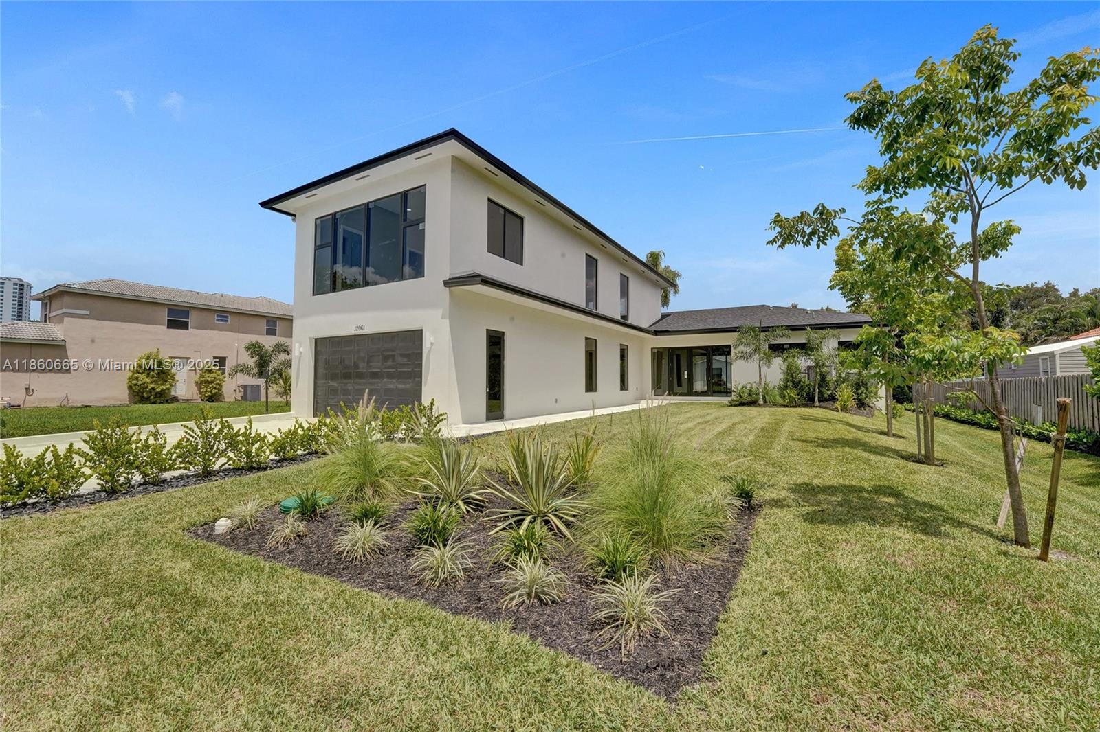 This brand-new two-story home in desirable Plantation Acres features 4 spacious bedrooms, each with its own private bath, plus an additional half bath for guests. High ceilings throughout enhance the open layout, creating an even greater sense of space and light. Luxury finishes, impact windows and doors, and a primary suite on the first floor highlight the thoughtful design. A two-car garage offers convenience, while the private lot provides room to build a pool and summer kitchen. Tucked at the end of a quiet cul-de-sac with no HOA, this property is the perfect blend of privacy, comfort, and modern living—ideal for families in a highly sought-after neighborhood.