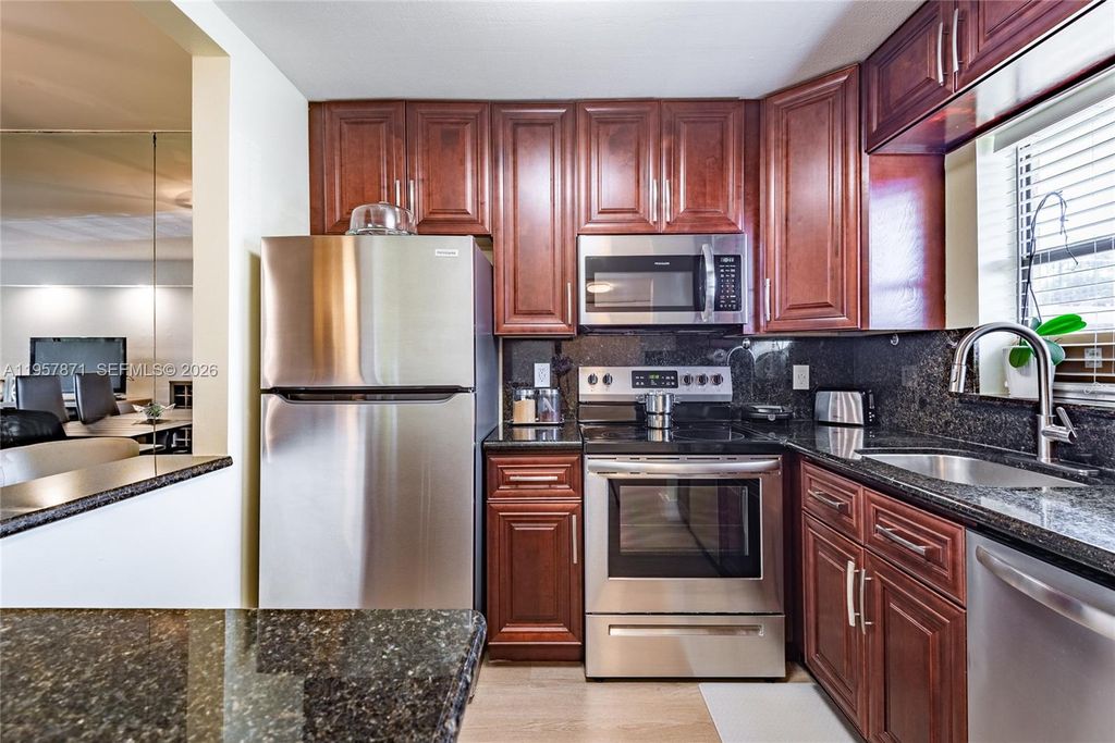 Photo of 9355 SW 8th St #105, Boca Raton, FL 33428 (MLS # A11957871)