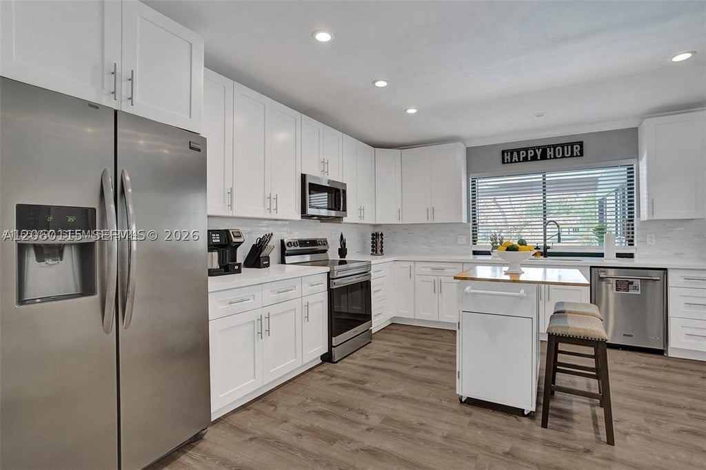 Photo of 1941 SW 52nd Ter, Plantation, FL 33317 (MLS # A12060115)