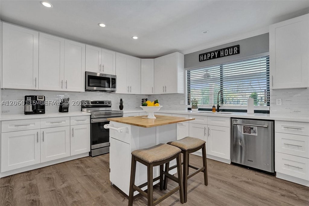 Photo of 1941 SW 52nd Ter, Plantation, FL 33317 (MLS # A12060115)