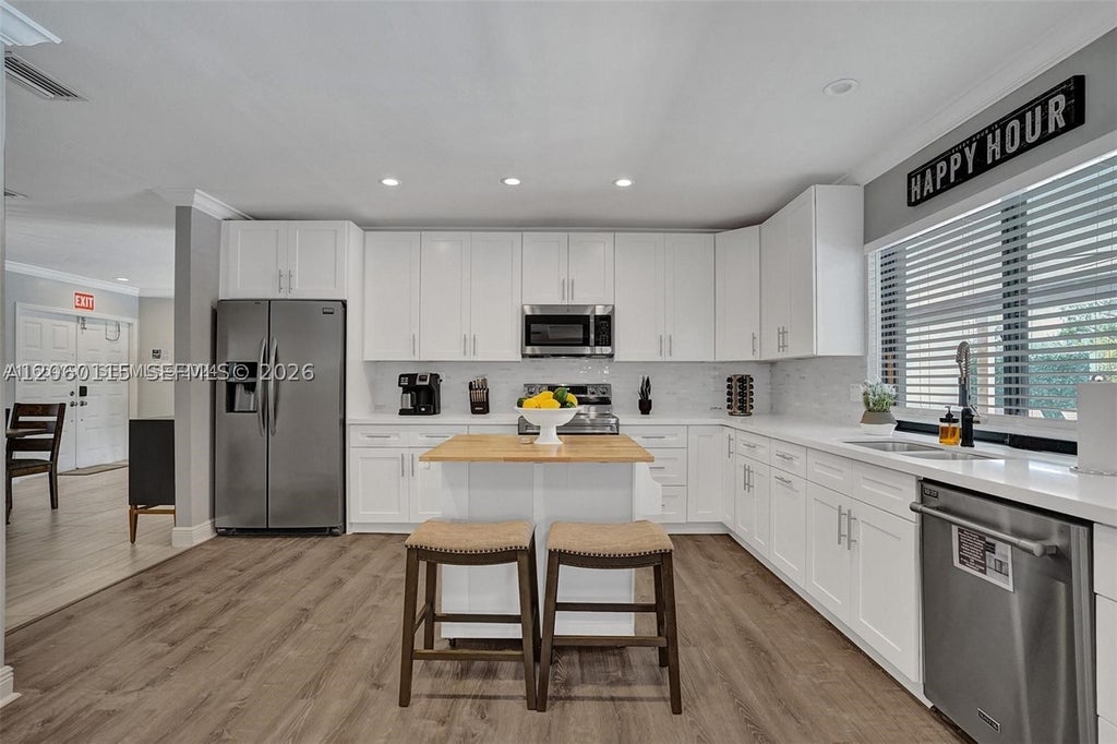 Photo of 1941 SW 52nd Ter, Plantation, FL 33317 (MLS # A12060115)