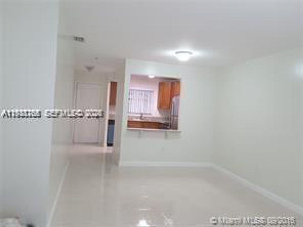 Photo of 6061 Shakerwood Cir #202, Tamarac, FL 33319 (MLS # A11938765)