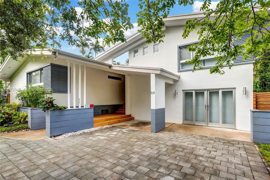 Located in Bay Heights, this 4-bedroom, 4.5-bath residence offers a bright, open layout filled with natural light, spacious living and dining areas, and a well-appointed kitchen with generous counter space. Terrazzo floors add character, while large windows and glass doors create seamless indoor-outdoor living. The home features a private den ideal for a home office, along with a room perfect for a playroom, media room, gym, or additional bedroom. A rare highlight is the impressive air-conditioned basement, providing substantial space not included in the main living area. The backyard embodies true Miami living, complete with a heated pool, covered terrace, and lush landscaping, perfect for relaxing or entertaining year-round. Ideally located just minutes from Coconut Grove, Brickell, Downtown, and Key Biscayne.