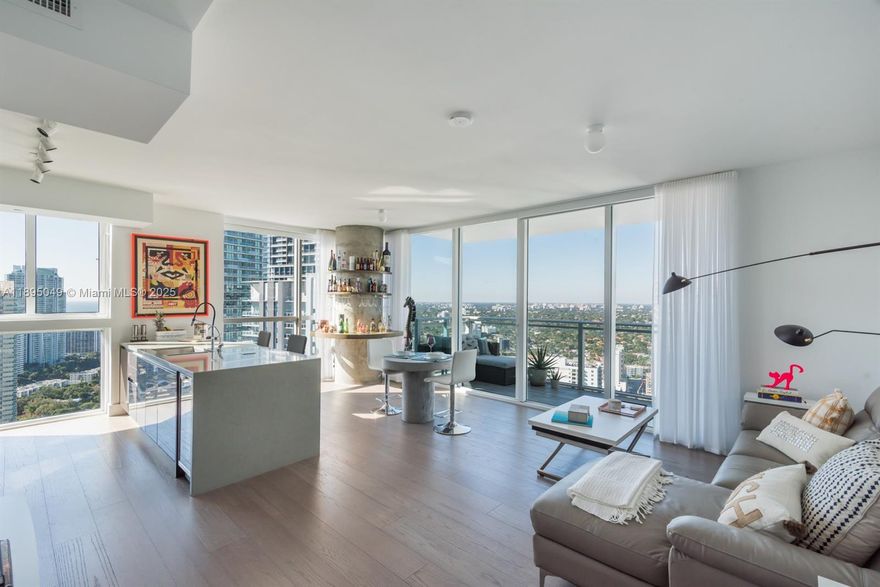Beautiful and functional 2Bed/2Bath condo, thoughtfully designed for comfortable living. Enjoy breathtaking sunsets and a premium open view of the ocean, Miami’s skyline, and the city lights. This residence stands out from others in the building with its personalized finishes, including premium European imported engineered floors, custom shades and blackouts throughout, built-in closets and cabinetry, and a stunning custom bar area that’s sure to impress.