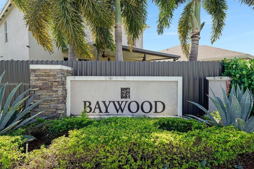 Beautiful corner home in Royal Homes West featuring luxury finishes and modern design. This 4-bed, 3-bath residence offers over 2,100 sq ft with an open kitchen, quartz countertops, and custom built-in entertainment wall. Wood-look tile downstairs, carpet only on stairs, and upgraded lighting throughout. Spacious fenced backyard with paved area and side gate — perfect for adding a pool, RV parking, or efficiency. Low HOA only $110 per month. Prime location near Florida City Outlet and US-1. Move-in ready and the best value in the community!