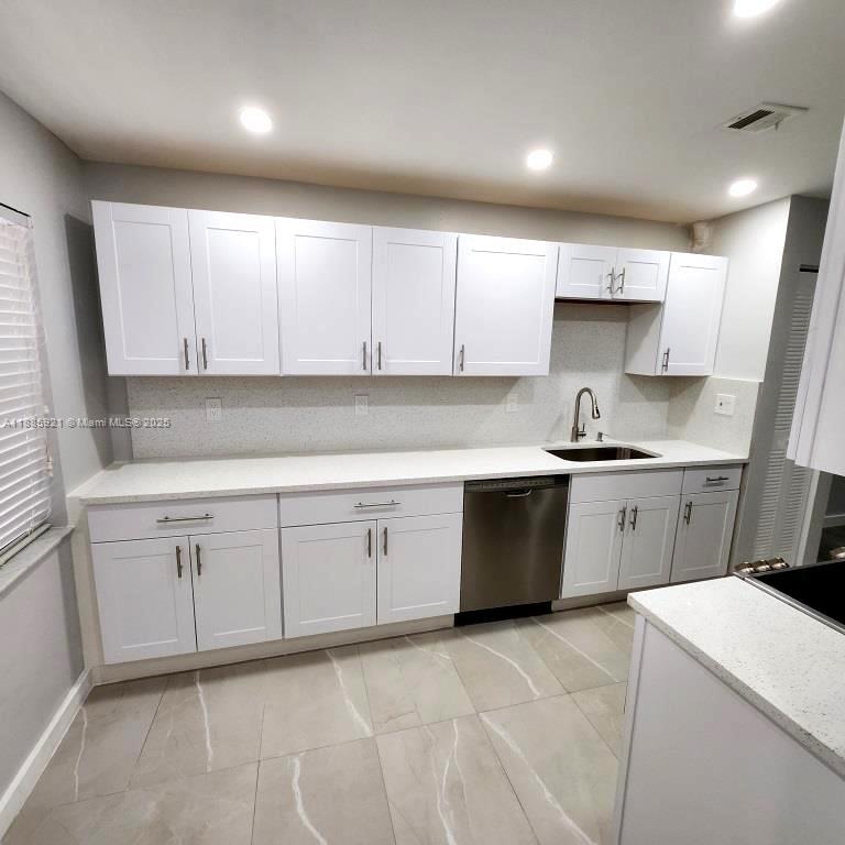 Perfect for Investors or those wanting to be an investor. This totally renovated 2BR/2BA ground floor/end unit with an excellent tenant in place @ $2100 monthly. This updated and renovated unit has new flooring, kitchen, vanities, and paint. Unit also has an in unit washer and dryer along with walk in closet in the en suite primary bedroom. The 2nd bedroom has a WIC with closet organizers. Quiet surroundings, but conveniently located by shops, restaurants, entertainment and services. Reasonable Association fees. No assessments currently planned.