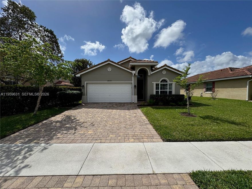 Welcome to this pristine 3-bedroom, 2-bath, 2-car garage home featuring single-story living, and is ready for immediate enjoyment. The upgraded kitchen opens seamlessly to the family room. The spacious primary suite features an oversized walk-in closet and a private ensuite bath with dual sinks, a soaking tub, and a separate shower. Ceramic tile flows through the main living areas, complemented by luxury vinyl flooring in all bedrooms—no carpet. Enjoy modern convenience with smart controls for the A/C, select lighting, and irrigation system. The light-filled open living spaces are ideal for everyday comfort and entertaining. Relax on the screened-in patio, perfect for unwinding or hosting guests. Additional highlights include a fully fenced backyard and impact windows and doors.