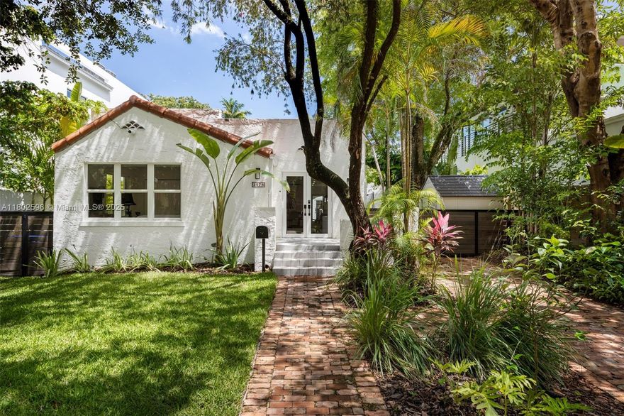 Captivating home on a quiet tree canopied street in prestigious North Coconut Grove. Recent major updates include: impact-rated windows & doors, new kitchen/bath cabinetry + new plumbing & light fixtures. Enter into light-filled living spaces featuring an original fireplace, wood-plank style tile flooring & a white color palette throughout. Open kitchen w/wood cabinetry, quartz counter tops and cooking island w/seating. Main house has 3BR/2.5BA + 1BR/1BA guest house with kitchen & living room. Enjoy outdoor living & entertaining in the ultra-private tropical back yard with grotto-style pool & waterfall. High sea-level elevation (not in a flood zone). Walk or bike to bayfront parks and the historic Grove village’s trendy boutiques & cafes. Just minutes to downtown, MIA & the Beaches.