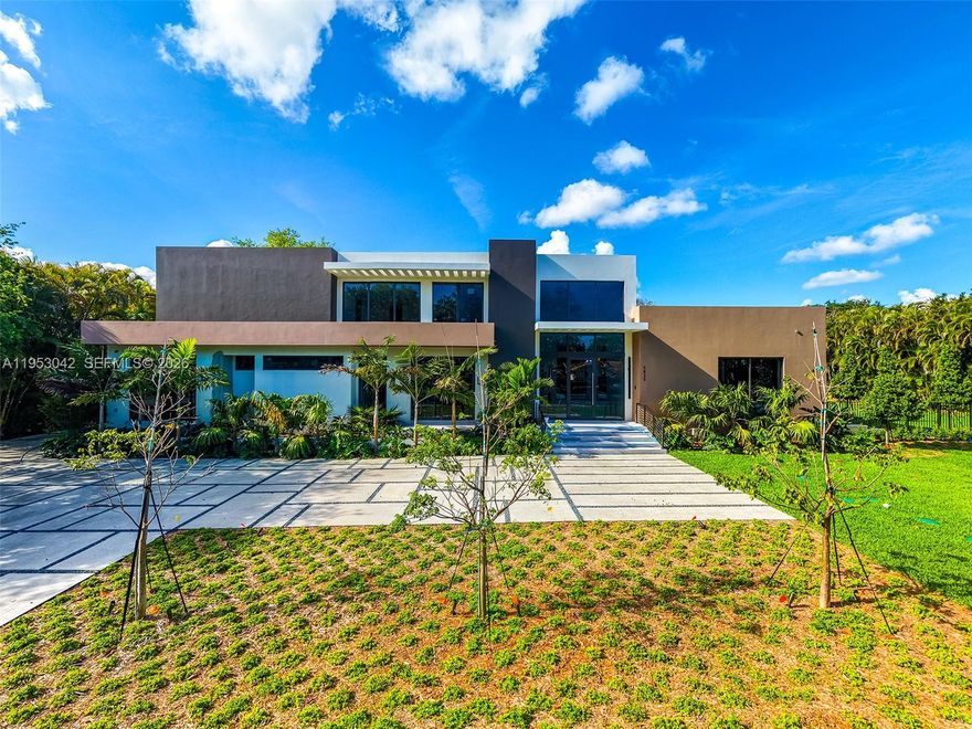 Nestled in the heart of Pinecrest, this brand-new construction residence sits on an expansive builder’s acre lot and features volume ceilings with floor-to-ceiling windows that flood the open-concept interiors with natural light. Designed for both everyday living and entertaining, the home offers 6 bedrooms and 7.5 bathrooms, formal dining, and a thoughtfully appointed wet bar. The kitchen is equipped with subzero and wolf appliances, Italian cabinetry, and custom built-ins. Additional highlights include a flexible room with en-suite bath, guest accommodations, cabana bath, elevator, concrete roof, three-car garage, covered terraces, and a summer kitchen is seamlessly integrated with the outdoor living areas and pool.