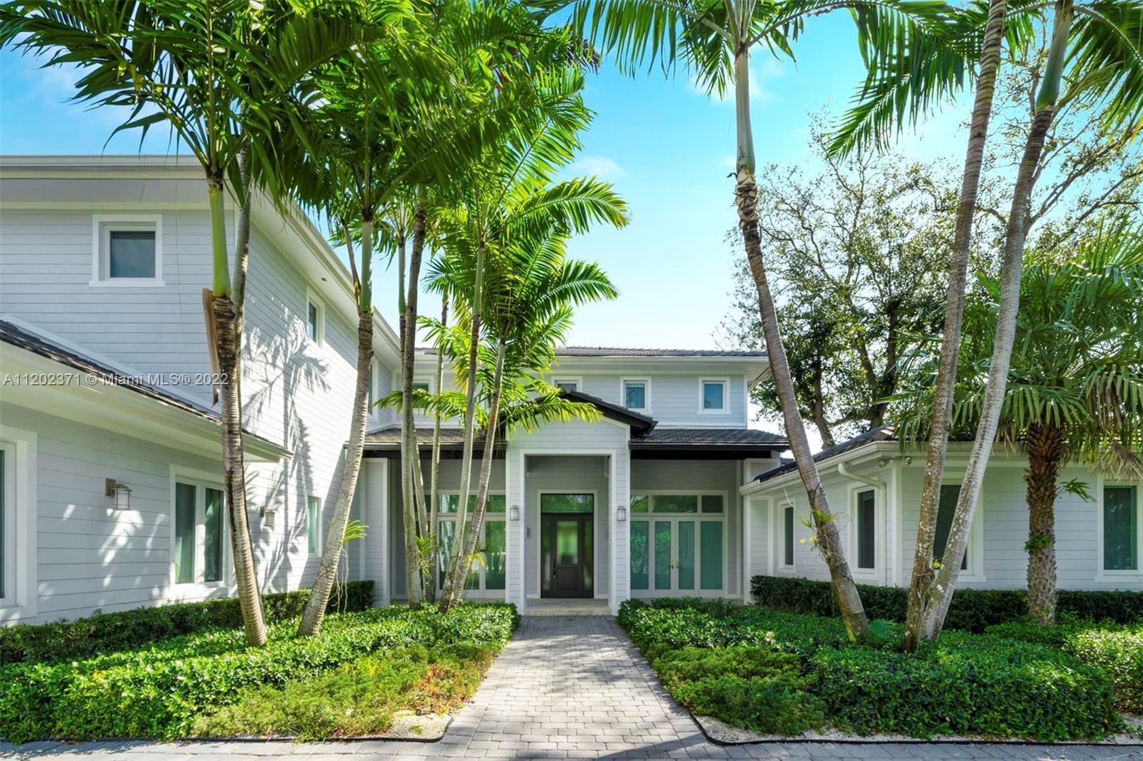 This stylish 7,473 Sq. Ft. home, with six bedrooms and six and one-half bathrooms, offers an oasis with multiple areas to relax and entertain. The open main living spaces have high ceilings, pool and garden views and a spacious family room ideal for entertaining. A gorgeous chef's kitchen comes with a long island, breakfast area, custom cabinets and top-of-the-line SubZero and Wolf appliances. The main suite has a covered terrace and an expansive resort-style bath with serene views. Nestled off the secluded backyard is a beautiful pool with jacuzzi, summer kitchen with outdoor dining area, and children's playground. A truly stunning home, conveniently close to excellent schools, main highways, malls, food stores and restaurants.