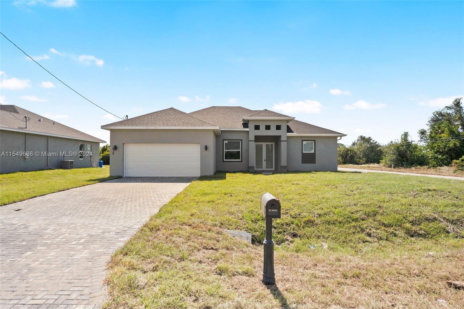 Brand New Construction home that features 4 bedrooms with 2 bathrooms. Front has paved driveway. 4th bedroom can be used as bonus room, den, playroom, or office. No hoa community. Completely turnkey home with tall 12-foot tray ceilings, all hurricane impact windows doors and windows, all high hat led lighting, base boards, and all TILE floors throughout. Open lay out concept with large walk-in closets. Master bedroom features double walk-in closets and double marble vanity. 10 foot island bar that is great for entertainment. s/s Samsung appliances and walk in pantry. Home features walk in laundry room and wet bar area for hook up. Oversized hurricane rated garage that can fit two cars and a boat.
