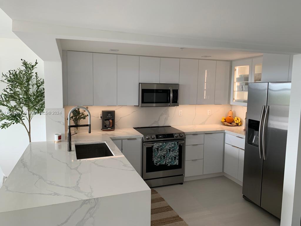 FULLY REMODELED UNIT & BUILDING. Enjoy stunning sunsets and expansive views from this 19th Floor 2 bedrooms and 2 full baths Condo in one of the best Full service buildings in South Beach. Located on 25th and Collins Club Atlantis features 24hr security, pool, gym, sauna, valet and guest parking. Location Location Location!! Just a few blocks north of all the action, this condo features enormous 100sqft balcony with unobstructed views of the bay and Downtown Miami. The sunsets are amazing. Impact windows. FULLY REMODELED. New WHITE PAINT for the ENTIRE BUILDING.