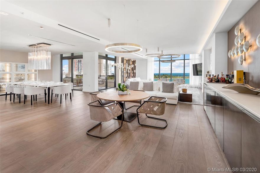 This turnkey, fully furnished designer unit by Henge at Palazzo Del Sol, the new luxury building on Fisher is stunning. No expense spared. This unit features 3,793 SF, private elevator entry, oak floors throughout, custom wallpapers, lighting, millwork & built-ins. Spacious open flow-thru layout w/extended living, family & dining areas with amazing views to Govt. Cut, city & Ocean. The chic gourmet Boffi kitchen sports top-of-the-line Gaggenau appliances & exotic stone counter tops/backsplash. A private principal suite offers direct terrace access & water views, & Book-Matched Statuario marble bath with walk-in glass-marble rain shower & sunken oval tub. The other 2 bedrooms w/en-suite baths & a shared terrace w/views to Fisher Island & Miami skyline. 5-Star Palazzo Del Sol amenities.