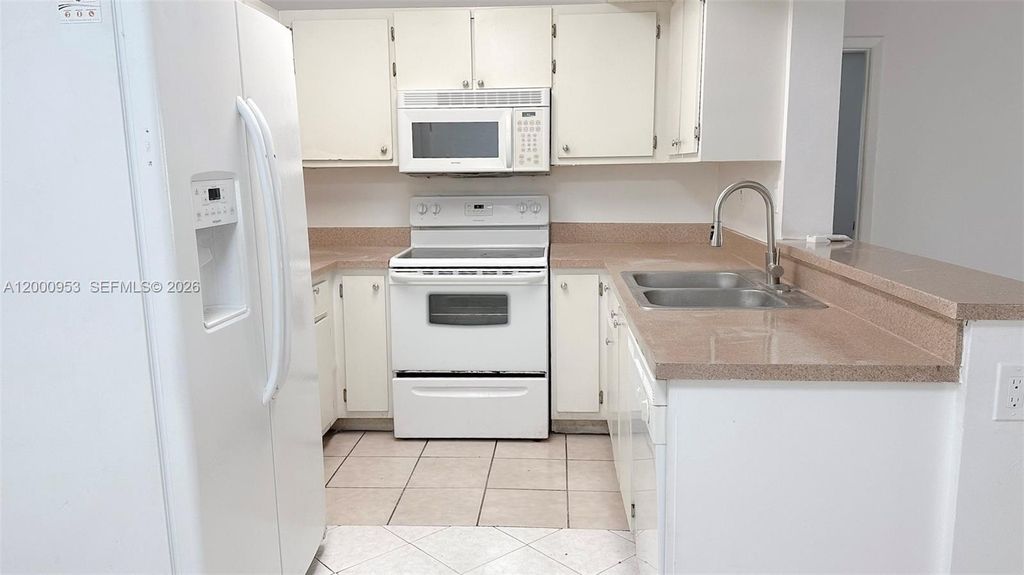 Photo of 9491 S Palm Cir S #103, Pembroke Pines, FL 33025 (MLS # A12000953)