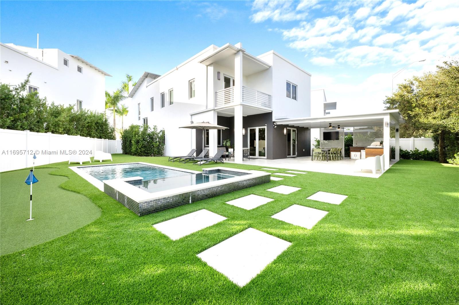This Stunning 2- Story, 4-bed, 5-Bath home, sits in the exclusive community of Oasis Doral. Oversized double lot with over 8,000 Sqft allows for customized backyard,4car driveway+2 car garage. Striking Backyard offers beautiful pool & jacuzzi, large stone pavers, turf throughout w/putting green, Custom Pergola & Summer Kitchen with top tier appliances and granite countertops. No backdoor neighbors + lush landscaping for ultimate privacy. Inside, the home impresses with double height ceilings/open concept, wine cellar, porcelain countertops, Italian wallpapers, new lighting distribution, window shades. Bedroom with private bathroom on 1st floor. Each bedroom has it's own bath & fully built closet, custom built office, laundry room on 2nd floor. Maintained by owners, Luxury at it's finest!