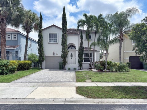 Photo of 199 NW 152nd Ave, Pembroke Pines, FL 33028 (MLS # A12097070)