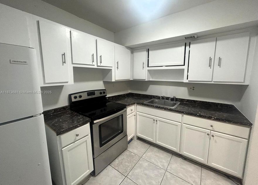 Welcome to Royal Point Condominium – Your Next Home Awaits! Step into this beautifully maintained 2-bedroom, 2-bathroom condo that perfectly combines comfort, convenience, and style. Enjoy a kitchen with sleek Formica countertops and crisp white appliances, designed for easy everyday living. Ideally located near schools, shops, and dining, this residence offers effortless accessibility to everything you need. The spacious primary suite includes a generous walk-in closet, providing ample storage for a clutter-free lifestyle. Experience the best of condo living at Royal Point — schedule your private tour today and make this inviting residence your next home sweet home!