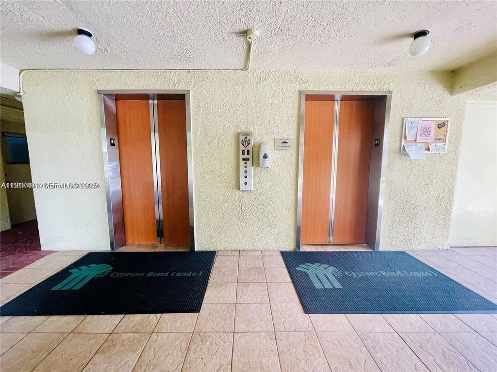 Photo of 2309 S Cypress Bend Dr #311, Pompano Beach, FL 33069 (MLS # A11917491)