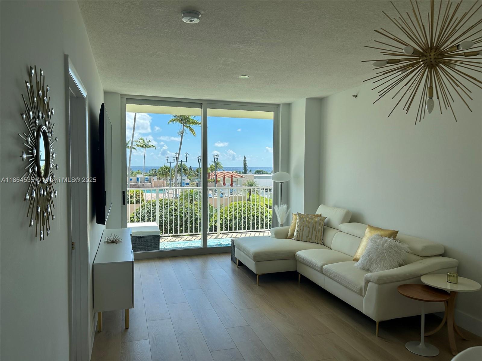 GORGEOUS OCEAN VIEW CONDO! The ocean view pool is centered in your 108” x 100” patio doors. It feels like your own private oasis. Resort style amenities include large pool with jacuzzi, double loungers with intercoastal view, tennis, bbq area, clubhouse with pool table and kitchen, large gym, front desk, and security. Located in the same driveway as Shooters Restaurant, Mastro’s, and one block from several restaurants, bars, and shopping. This nicely renovated unit has brand new laminate floors, baseboards, paint, range hood, chandeliers, nest a/c, smart lights, faucets, hardware, hinges, etc. ALL BRAND NEW FURNITURE included in price, including 85” QLED TV and 65” TV! HOA dues include DIRECTV, internet, water, sewer, trash, security and gated parking.