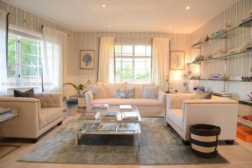 Completely renovated and furnished, corner apartment within the Gibson building. The apartment has undergone a complete renovation by a renowned architect and interior designer, featuring a large living area overlooking the building's internal garden, a formal dining area, a  kitchen, a large bedroom with walk-in closet and bathroom with shower, all furnished with meticulous attention to detail. The unit features hurricane-resistant windows and doors. The renovation was not only aesthetic but also structural, reinforcing the entire floor and ceiling.