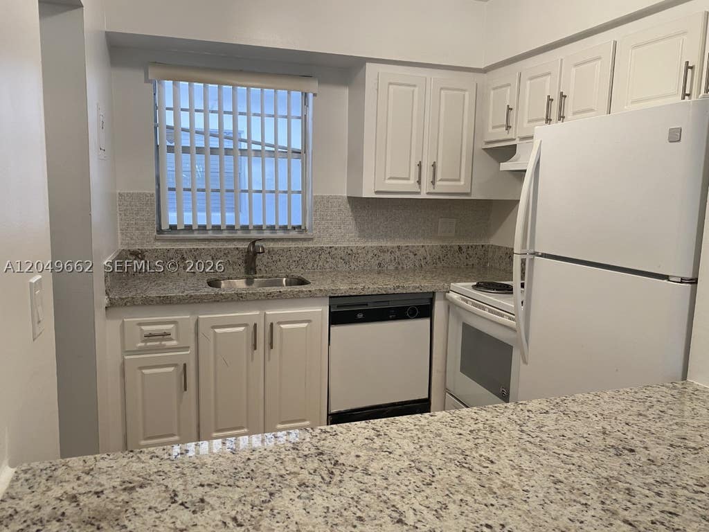 Photo of 6501 Winfield Blvd #A-53, Margate, FL 33063 (MLS # A12049662)