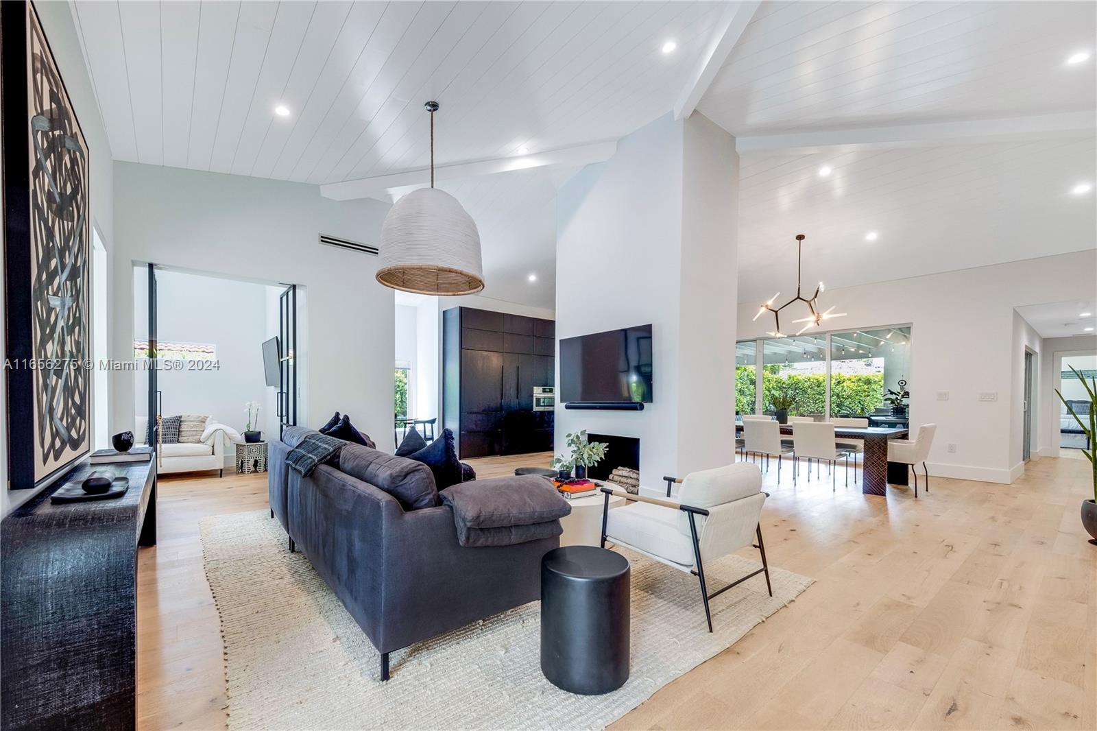 Tulum-style cool meets Miami modern in this chic, recently updated Silver Bluff residence. Minutes from Brickell & Coconut Grove, near excellent schools and transit options. Interiors feature wide-plank white oak floors, designer finishes, and ample natural light. Spacious living & dining areas boast dramatic vaulted ceilings and island kitchen with marble counters and new appliances. A cozy breakfast nook and serene den offer quiet retreats. The primary bedroom with luxurious en-suite bath ensures privacy. Outdoor living shines with a heated saltwater pool, large grilling station and comfortable shaded area for lounging or dining. Seamlessly blending indoor-outdoor living, this tastefully renovated home offers a perfect balance of style, comfort, and convenience in a superb location.