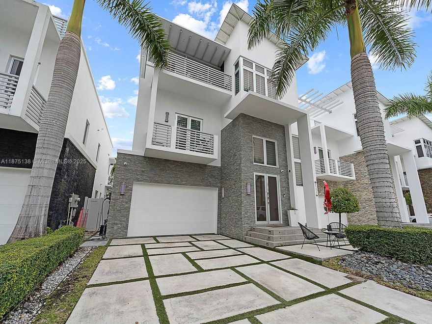 Live in style in the exclusive Oasis Park Square at Doral community! This tri-level home is impeccably renovated & loaded with premium features: a private heated pool, a chic glass wine cellar, & a chef’s kitchen outfitted with S.S appliances. The over-sized master suite offers a spa-like bathroom & a generous walk-in closet. All other bedrooms offer the privacy of its own ensuite bathroom. With dual A/C units, this home ensures ultimate comfort in every corner. The crown jewel is the rooftop terrace, fully equipped with a BBQ, jacuzzi, artificial grass garden, TV, & a full bathroom—perfect for entertaining. Best of all, the home’s backyard gate gives direct access to CityPlace Doral, where a vibrant selection of restaurants & nightlife awaits. A perfect blend of luxury & comfort!