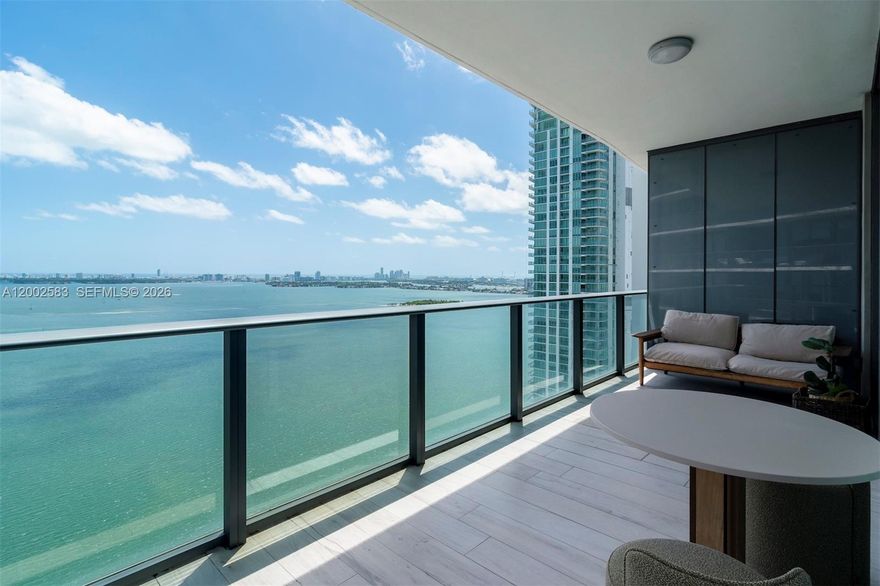 Luxury corner residence at Gran Paraiso with a sprawling wraparound terrace and breathtaking, unobstructed views of Biscayne Bay, the Intracoastal, the ocean and the Miami skyline. Offering 3 bedrooms and 3 baths across 1,649 SF and 2 parking spaces, this high-rise home pairs an open, light-filled layout with a chef’s kitchen featuring a cooking island, and elegant finishes including marble, ceramic and concrete flooring. Enjoy peace of mind with a full-service, secured building (doorman, card-entry and elevator security) plus high-impact windows and doors. Gran Paraiso delivers true resort living: a 2-acre pool deck with cabanas, spa, state-of-the-art fitness center, business center, tennis courts, putting green, and indoor sports amenities including bowling lanes and a golf simulator. Entertain in refined club rooms and lounge areas, store vintages in private wine cellars, or unwind in the cigar lounge with private humidors. Residents also enjoy a private beach club and waterfront dining at Amara at Paraiso by acclaimed chef Michael Schwartz, along with a bayfront park and onsite boat docks and slips. Includes 1 assigned parking space plus guest and valet parking.