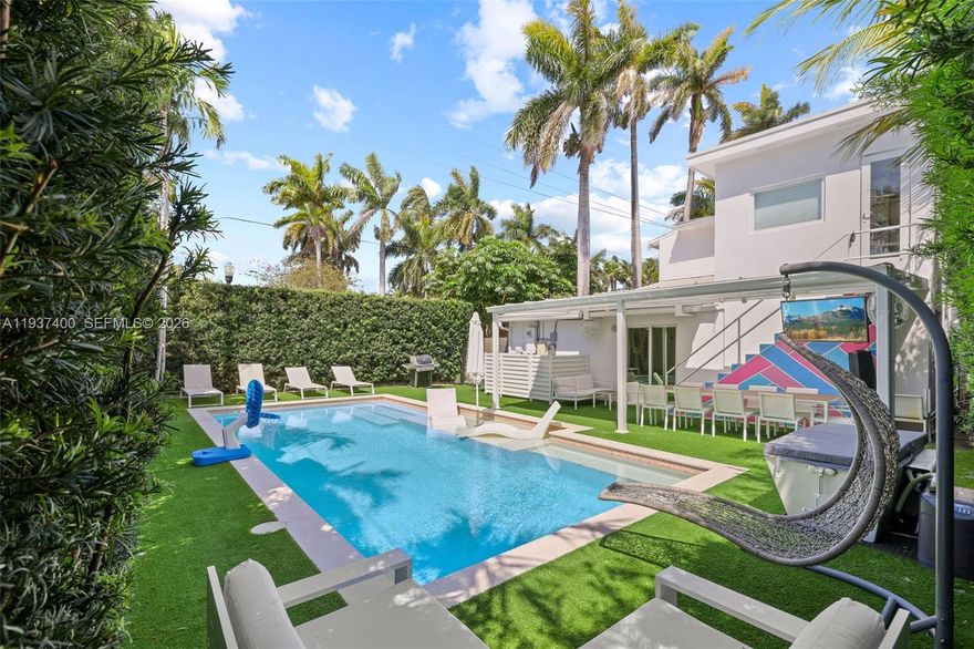 Experience the best of Miami Beach living in this Art Deco corner lot residence. Thoughtfully renovated to preserve its original charm, this two story home features a brand new roof completed in 2025, a grand marble fireplace, and beautifully restored original wood floors throughout. The thoughtfully designed floor plan offers three bedrooms upstairs, including the primary suite, along with two bathrooms. The main level includes an additional bedroom with an en suite bathroom, ideal for guests or multigenerational living. The spacious kitchen blends classic character with modern convenience and offers sleek cabinetry, stainless steel appliances, and a built in wine fridge, making it ideal for both everyday living and entertaining.

Outdoors, enjoy an expansive pool and yard area complemented by a private basketball court. An additional office or flex space, accessible via exterior stairs, provides a versatile setting for a home office or gym. Set on a picturesque tree lined street just minutes from 41st Street shopping, the beach, and with easy access to the Design District, Downtown Miami, and Miami International Airport, this home offers a rare combination of charm, space, and location.