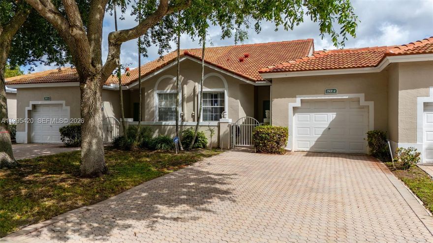 Beautiful water-view home located in a gated community in the heart of West Sunrise! This residence features a bright, open layout with high-volume ceilings that create an airy and inviting atmosphere. The renovated and open kitchen offers modern finishes, perfect for both everyday living and entertaining. Enjoy two private balconies—one off the living room and another from the spacious primary suite. The primary suite is a true retreat, showcasing elegant tray ceilings and serene water views. Additional highlights include an interior walk-in laundry room, a one-car garage, and accordion shutters throughout for added peace of mind. Major updates include a new roof (2025), newer A/C, and water heater. The low HOA includes ADT security, Comcast cable with HBO Max, landscaping, pool maintenance, and roof cleaning—providing exceptional value and convenience. This resort-style community offers top-tier amenities, including two pools, a gym, tennis courts, a hot tub, and more. Centrally located, you're just minutes from major shopping, dining, and highway access—making commuting a breeze. Don’t miss this opportunity to own a home with stunning water views and a beautiful backyard setting—this one won’t last!