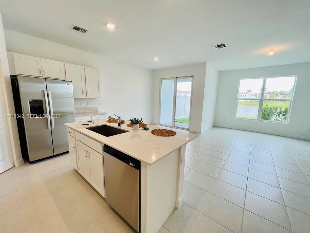 Photo of 6909 Harbours Edge Ave #6909, Lake Worth, FL 33467 (MLS # A12010342)