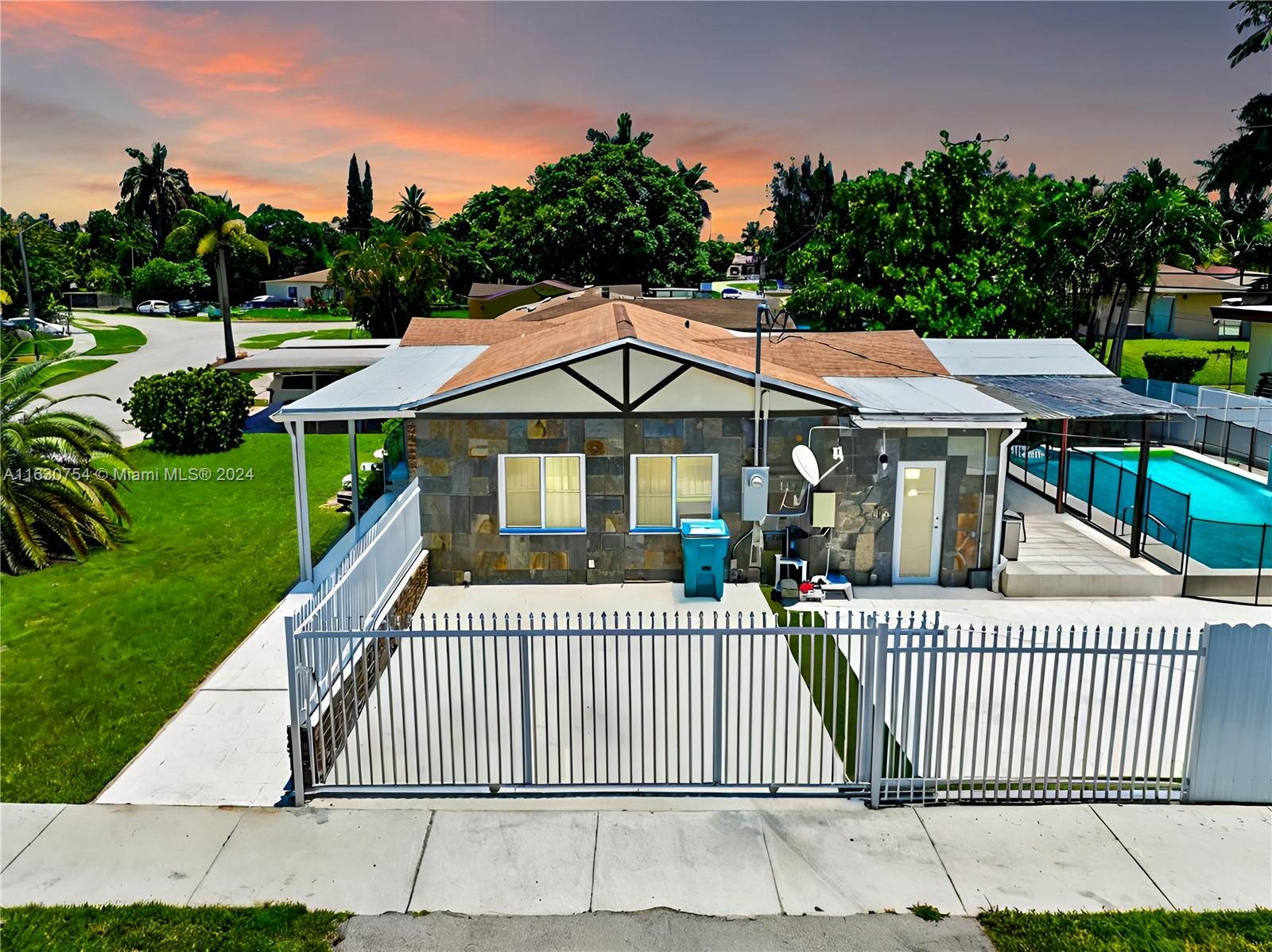 Stunning fully renovated single-family home with pool on oversized corner lot. The property features 3 bedrooms and 2 full bathrooms. Porcelain marble tile floors throughout.Open floor plan seamlessly connects the living & dining areas, while the fully functional kitchen boasts stainless steel appliances and breakfast bar. Step outside the covered patio by the modern elegant pool with the waterfall feature. Newly installed roof, impact windows and doors. Fenced yard for privacy and relaxation with the soothing sound of waterfall. Huge paved backyard for RV & Boat parkings. No HOA!!! 5 mins away to Miami-Dade North Campus & next to Miami Shores and close to Hialeah, Miami Springs, Miami International Airport, South Beach & Wynwood. Enjoy immersive 3D Virtual tour. May the FORCE be with you!
