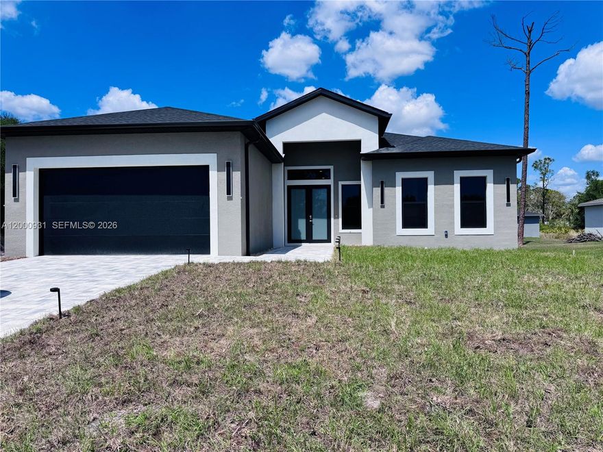 2026 New Construction Masterpiece in Port Charlotte! This architectural gem redefines luxury with 10-ft ceilings and a stunning open design. Features a Private Smart- Income Suite with a separate entrance—perfect for short-term rentals or guests to help offset your mortgage. The chef’s kitchen shines with custom soft-close cabinetry, exotic granite, and premium Samsung appliances. Enjoy high-end finishes like large-format Spanish porcelain tile and spa-like baths. Built for safety with full impact-rated windows and a reinforced 2-car garage. Your oasis awaits with an expansive backyard, BBQ area, and a large lanai with a dedicated pool bath—ready for your future pool. Prime location just 4 mins from Walmart/Home Depot and close to Gulf Coast beaches. High-design homes with income potential sell fast- schedule your private tour today!