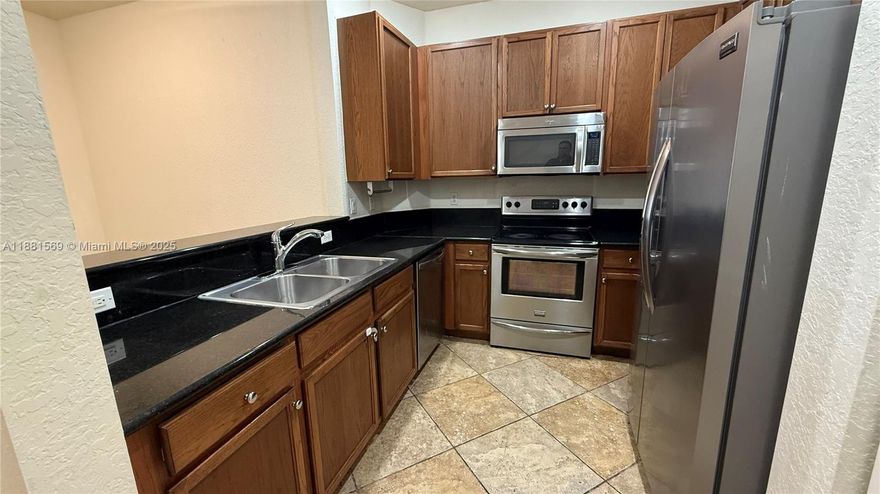 This first floor 3 Bed 2 Full Bath Corner Villa style Condo inside the meticulously maintained Hampton Hills gated community has a private Driveway & a 1 car garage plus Granite Counter's on wood cabinets, Tile floors, walk in closets, lots of storage and plenty of windows to let in the sunlight. Close to major highways, minutes from Sawgrass Mall, Hardrock Casino, Beaches and sporting venues.